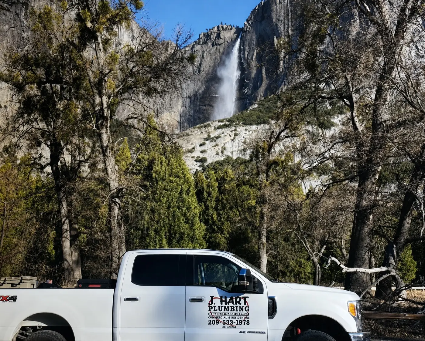 J. Hart Plumbing service truck below Yosemite Falls, serving Sonora and Tuolumne County